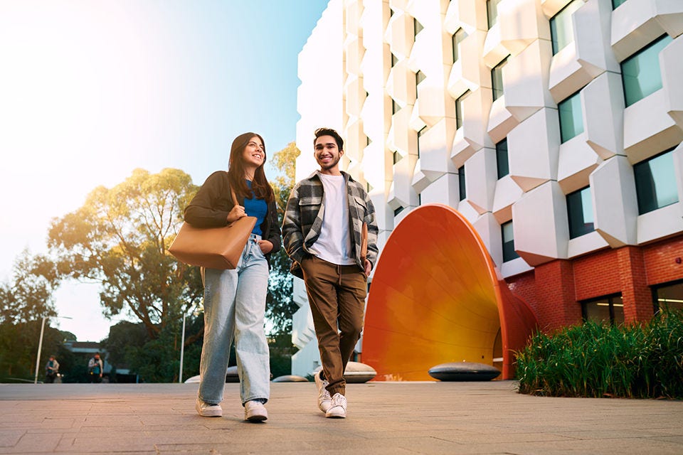 A pair of students walking to class