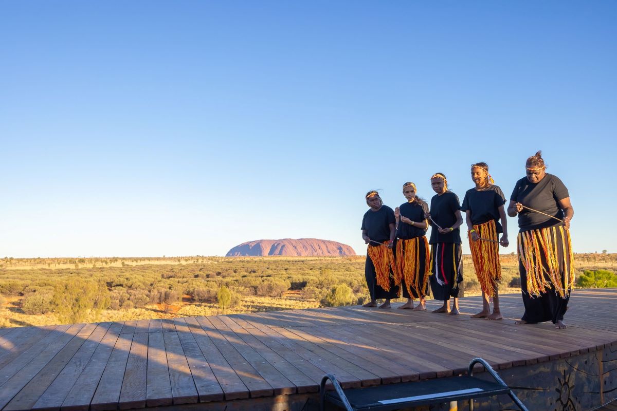 Australian indigenous women with Uluru in the background