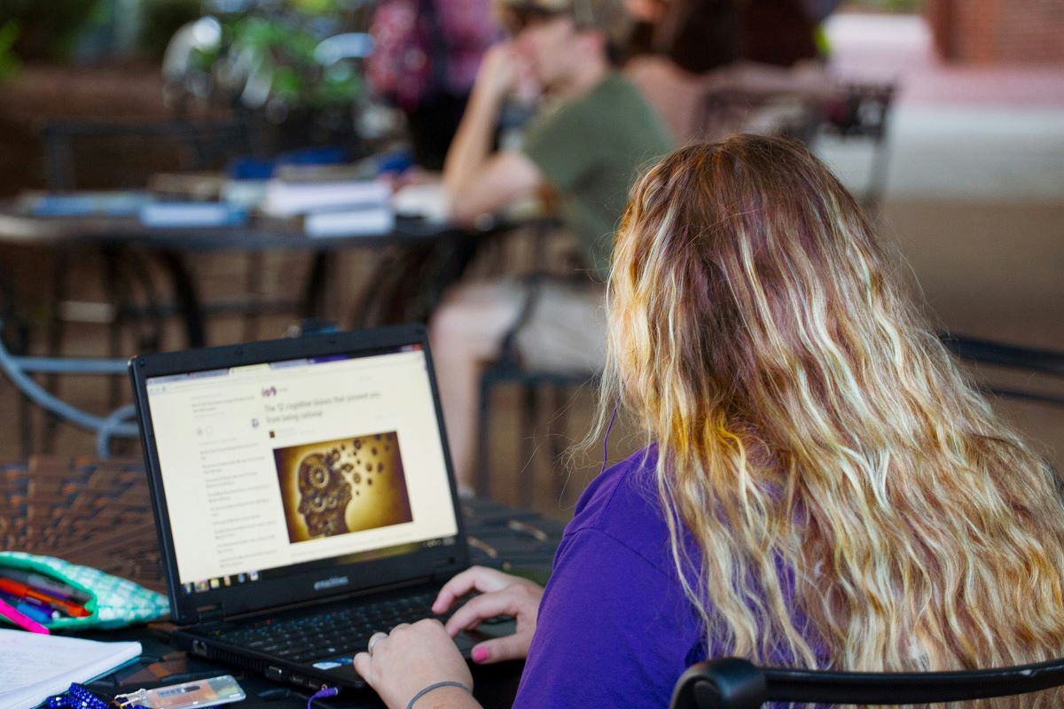 A female student on a laptop